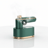 Portable mini steam iron dark green with gold trim on its base